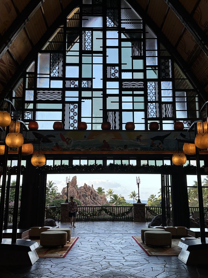 The open-air lobby at Aulani, a Disney Resort and Spa, looking out toward the ocean