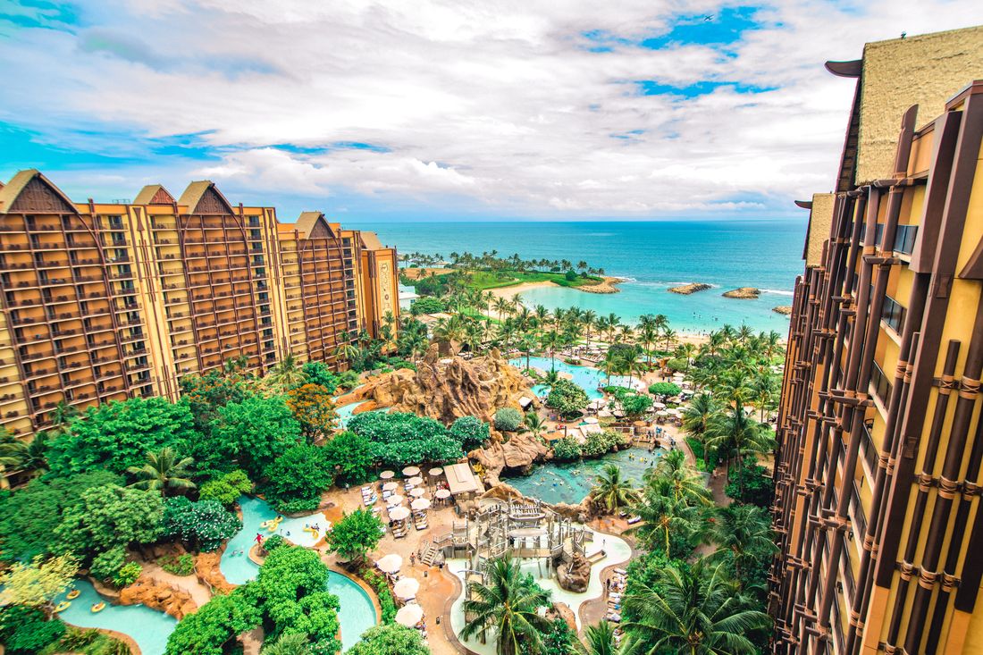 Aulani, a Disney Resort and Spa, with its pools and lagoon along the beach in Oahu, Hawaii