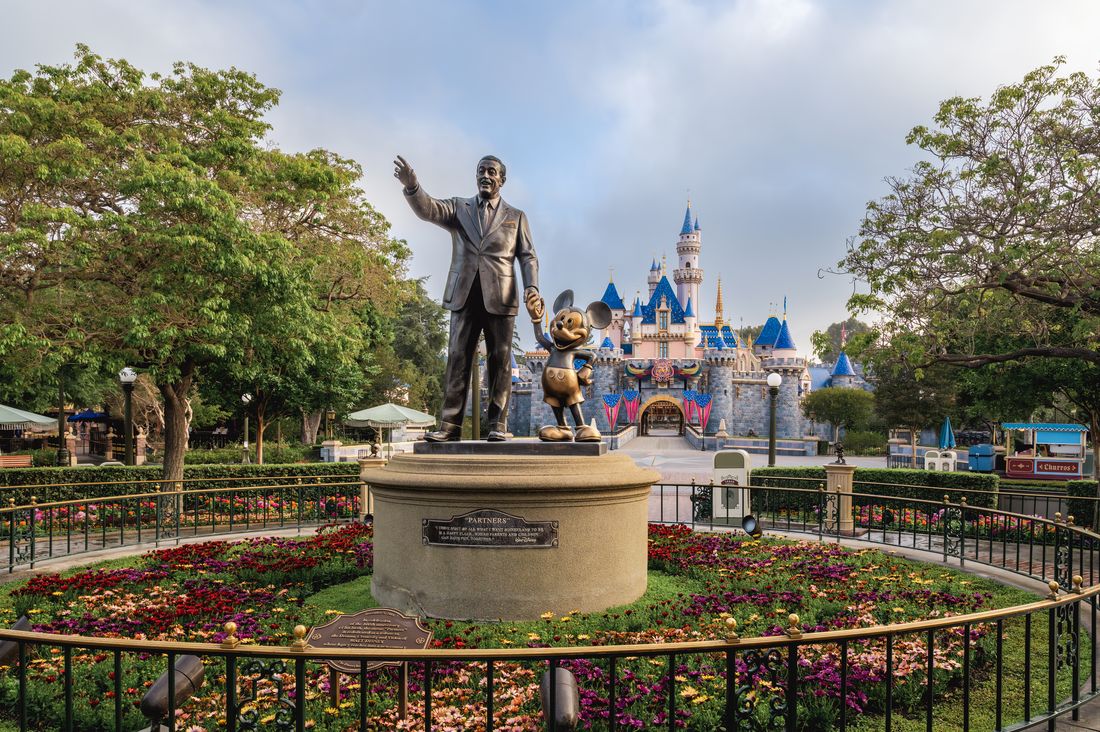 The Partners statue of Walt Disney and Mickey Mouse in front of Sleeping Beauty Castle at Disneyland